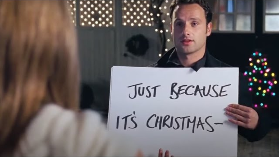 Mark holding "Just because it's Christmas" sign in the movie Love Actually