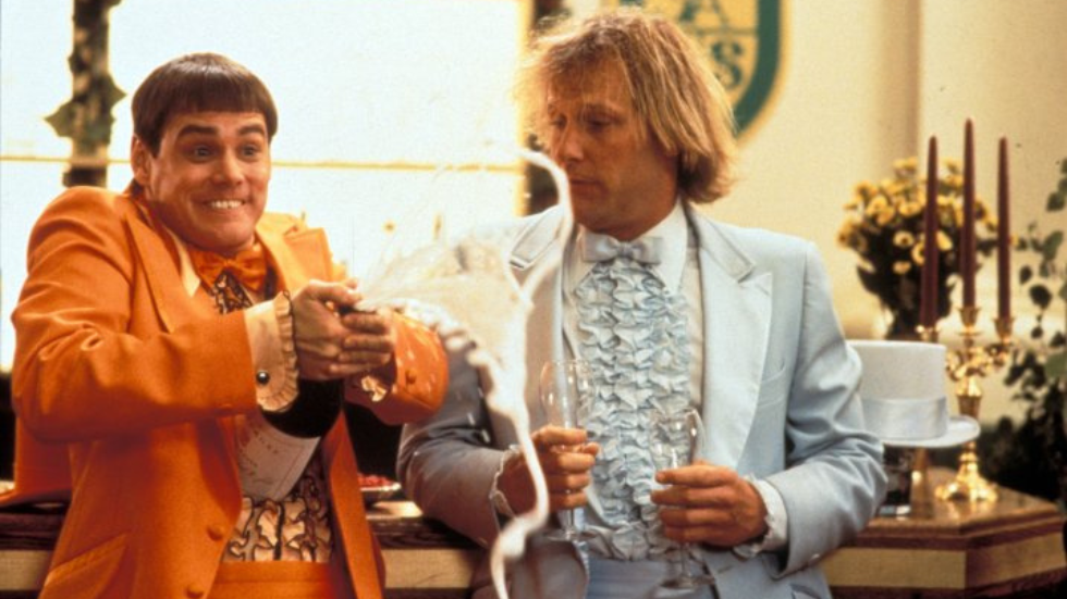 Dumb and Dumber popping a bottle of champagne